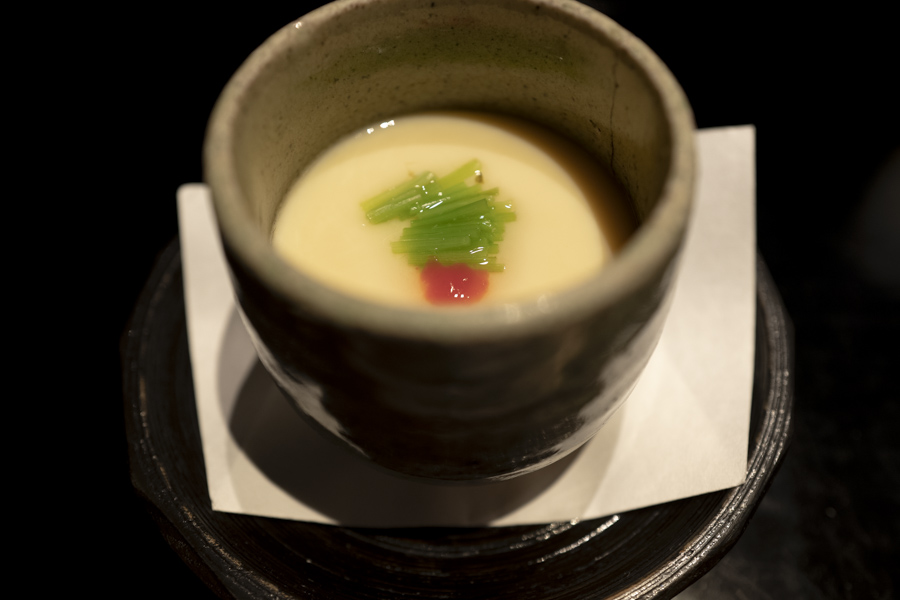 焼き蕗の薹ごま豆腐 べっ甲餡かけ　蕗の薹うす衣揚げ　白髪葱　針柚子　山葵